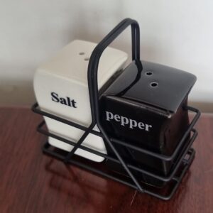 Salt and pepper shaker pot in black metal rack